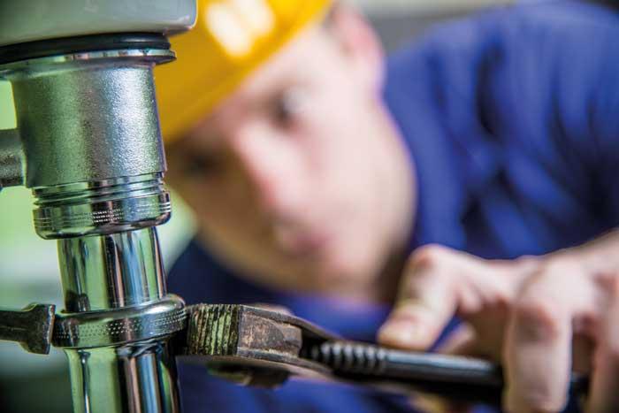 Contractor working on pipework 